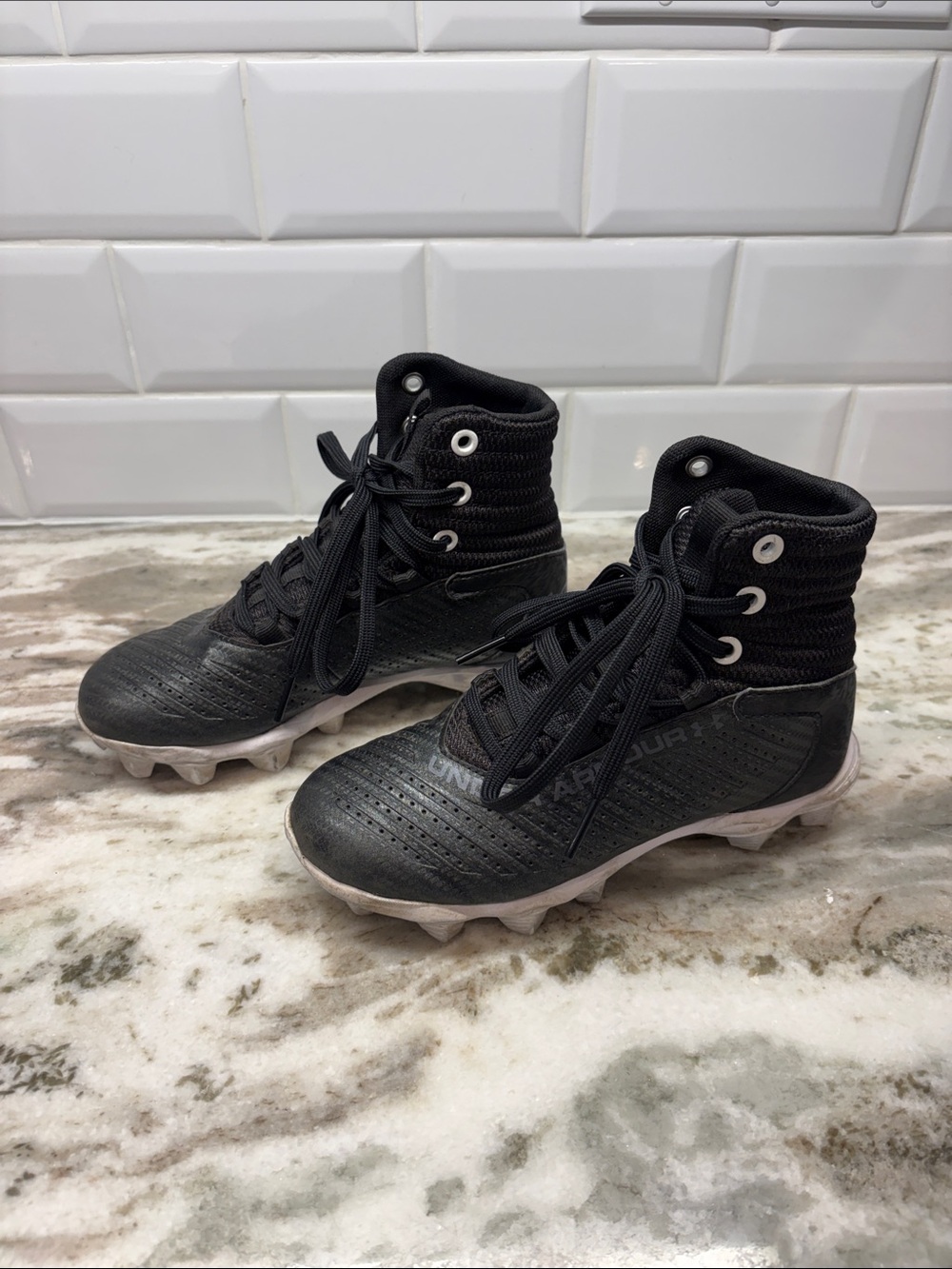 Under Armour Kids Black High-Top Cleats with White Soles